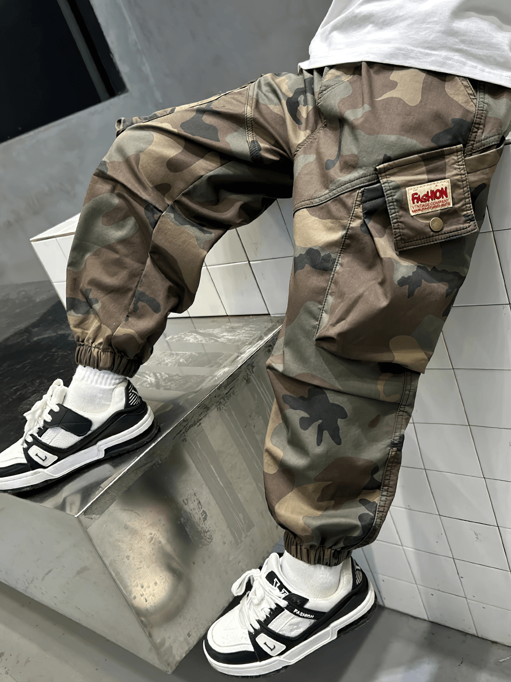 Boys Camouflage Jogger Pants with Elastic Waist - SF3871 showcasing sporty style with ruched details and cuffed hems.