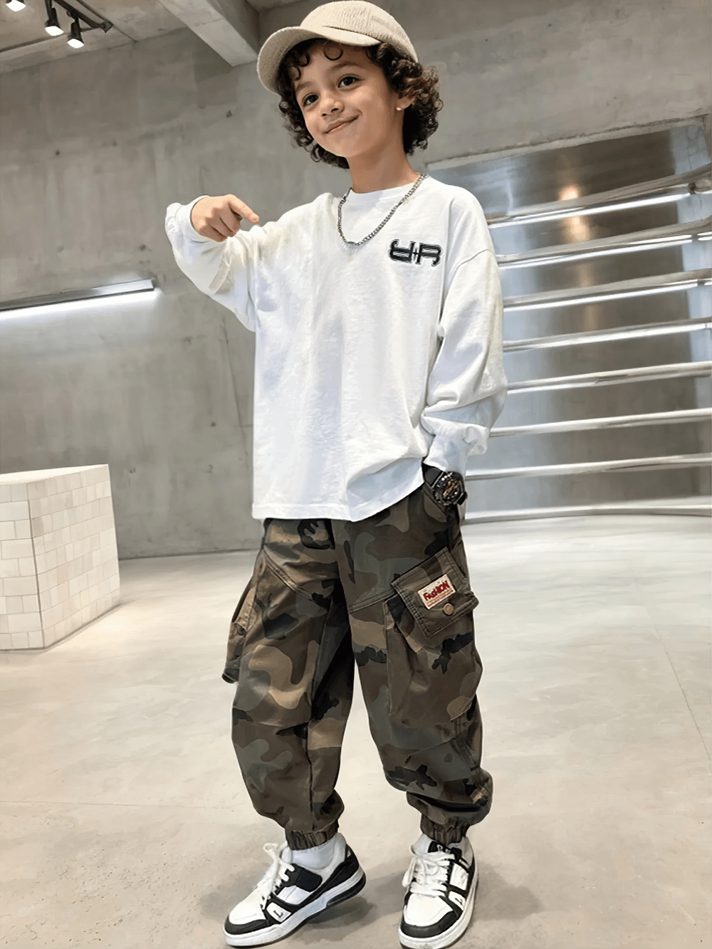 Young boy in Boys Camouflage Jogger Pants with Elastic Waist - SF3871, trendy style with relaxed pose in a modern setting.