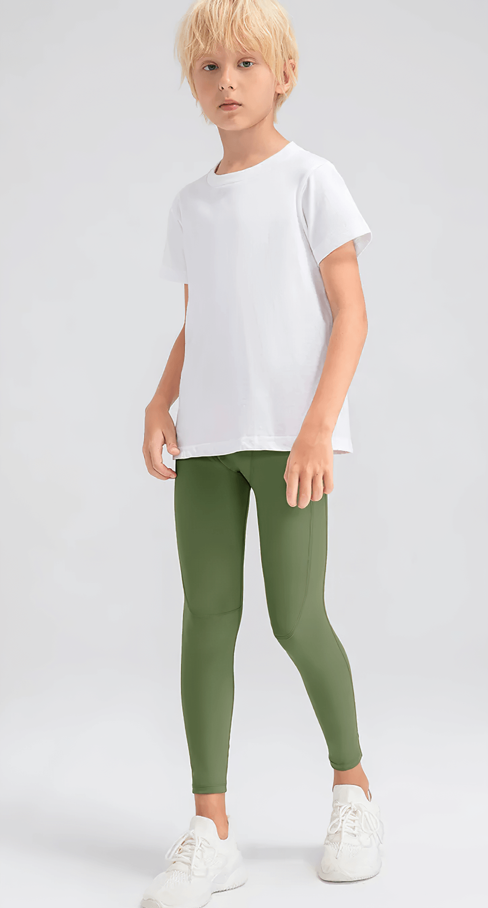 Boy wearing Boys Compression Sports Leggings for Training - SF3794 in green, perfect for active sports sessions and team activities.