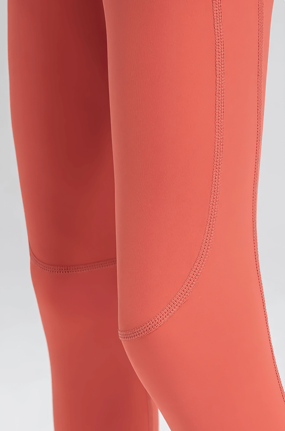 Close-up of Boys Compression Sports Leggings for Training - SF3794 in vibrant orange, showcasing the sleek design and quality stitching.