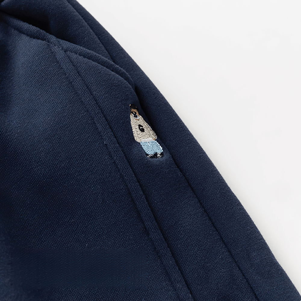 Close-up of Boys Fleece Lined Sport Jogger Pants with Cuffs - SF3912 featuring a logo detail on navy blue fabric.