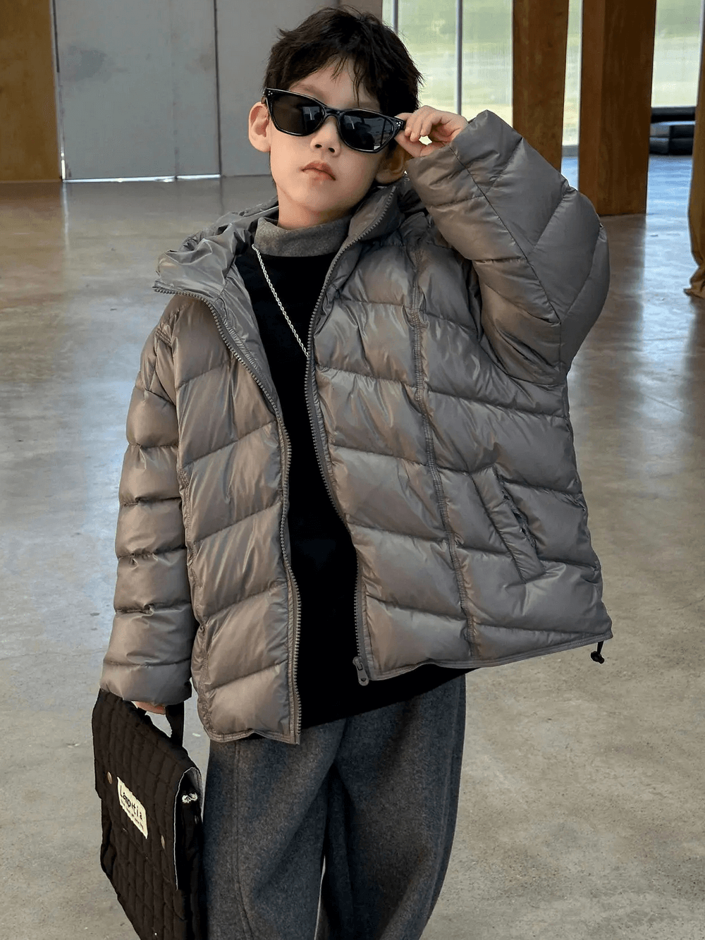 Young boy modeling Boys Hooded Down Puffer Jacket With Zipper - SF3638 in a stylish indoor setting.
