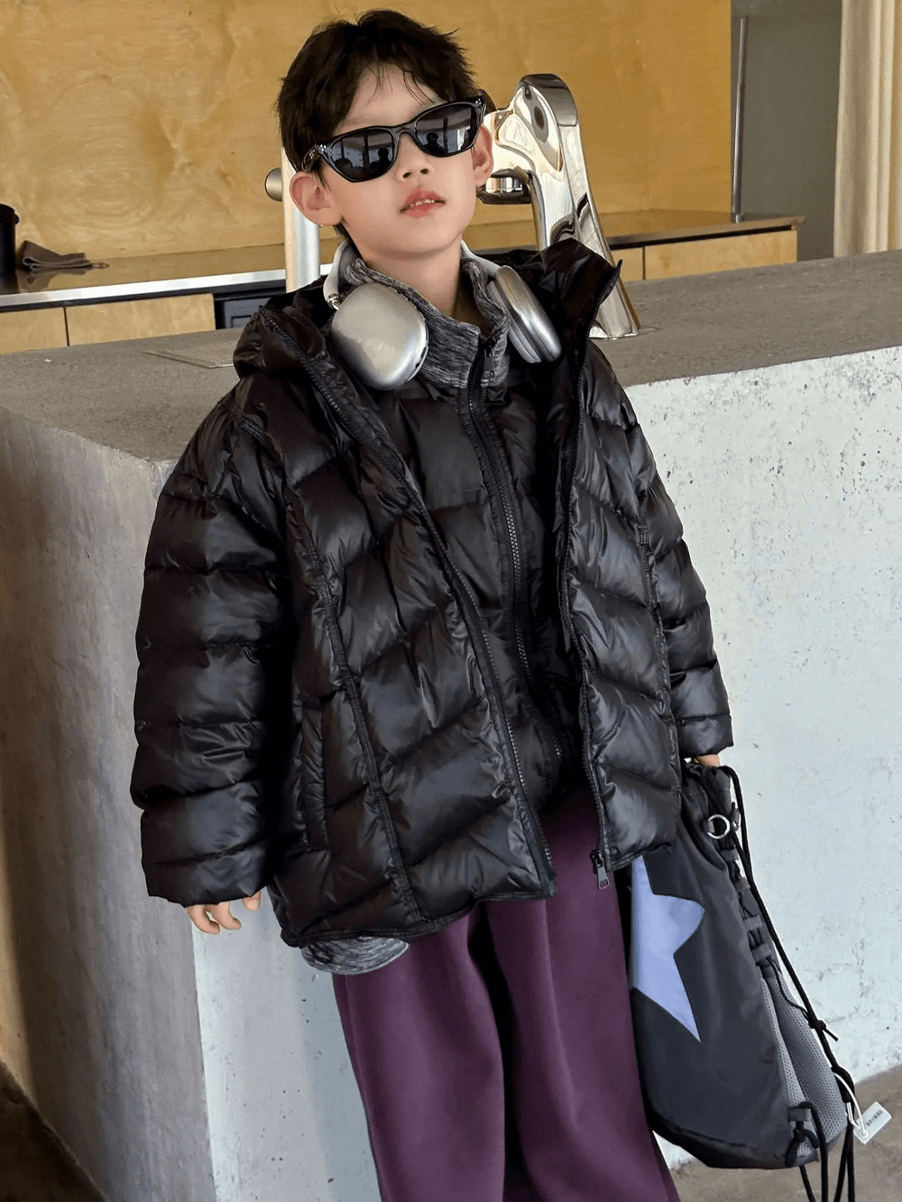 Stylish boy in Boys Hooded Down Puffer Jacket With Zipper - SF3638, looking cool with headphones and sunglasses.