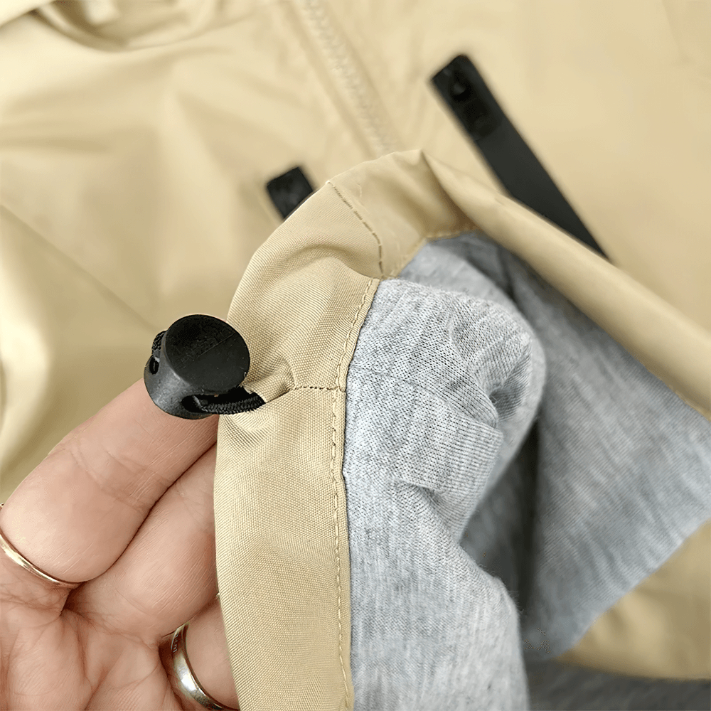 Close-up of tan Boys Hooded Zipper Windbreaker Jacket - SF3565 highlighting the zippered sleeve and material details.