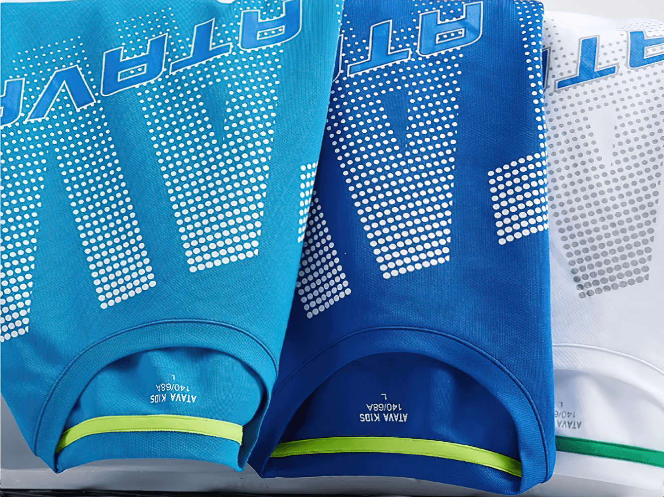 Vibrant Boys Quick-Dry Long-Sleeved Sports Top for Running - SF3601 in blue shades with bold graphics displayed on a rack.