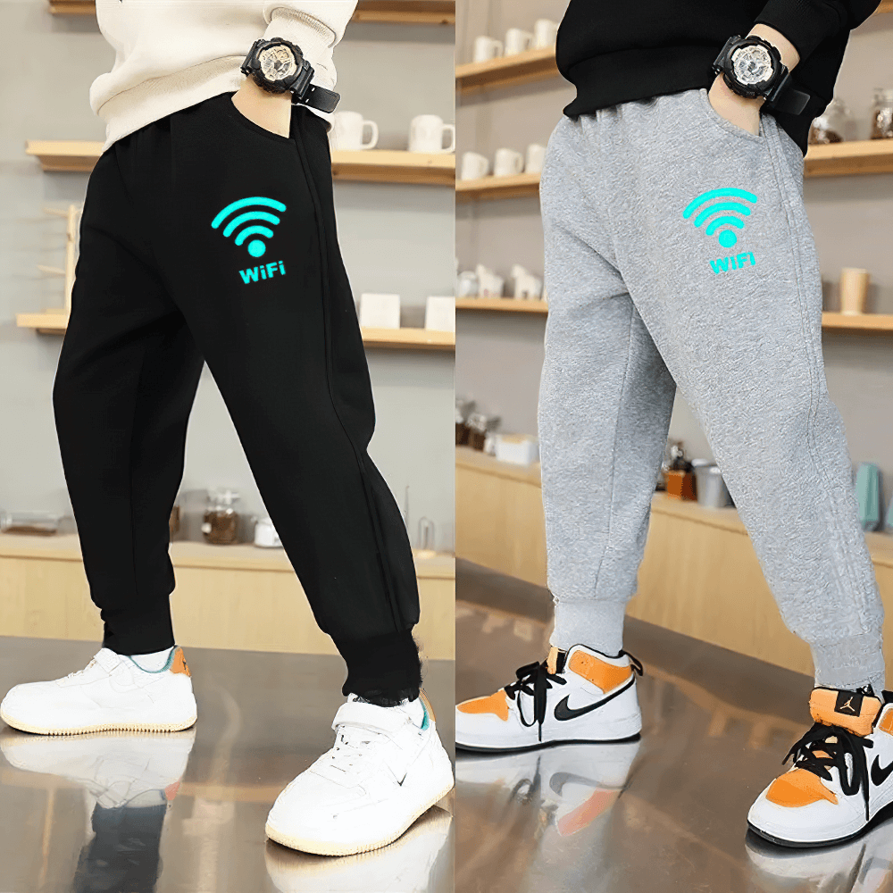Trendy boys in black and gray jogger pants with luminous WiFi prints, perfect for active days.