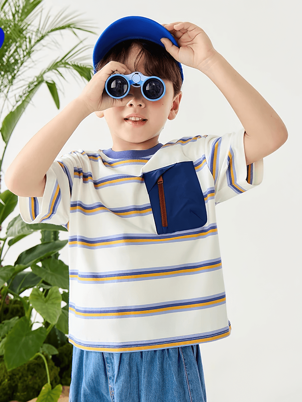 Young boy wearing Boys Stripe T-Shirt with Zipper Chest Pocket - SF3682, holding binoculars, ready for outdoor adventures.