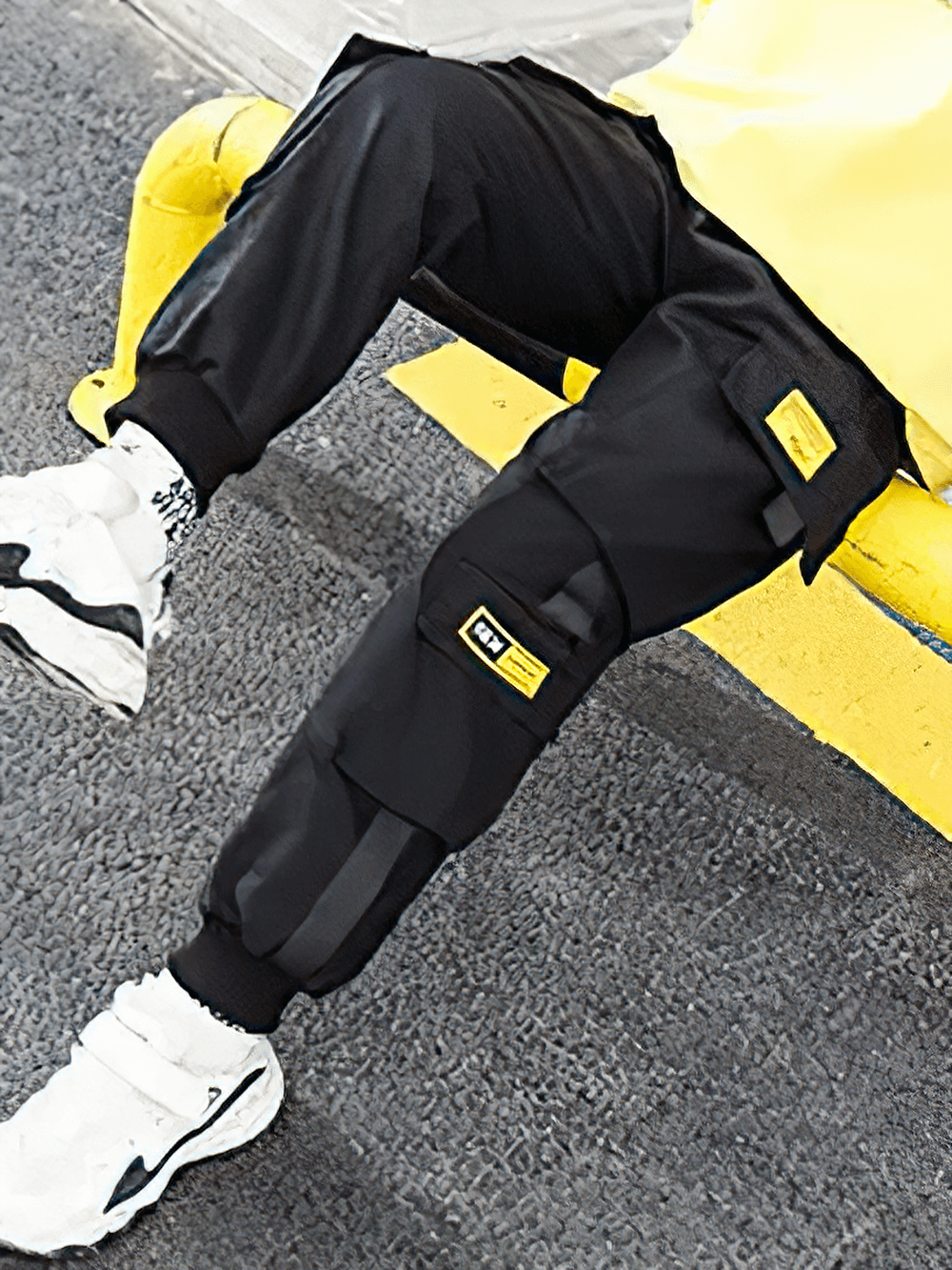 Boy wearing Boys Stylish Sport Cargo Jogger Pants - SF3868 with elastic waist and multiple flap pockets, perfect for urban play.