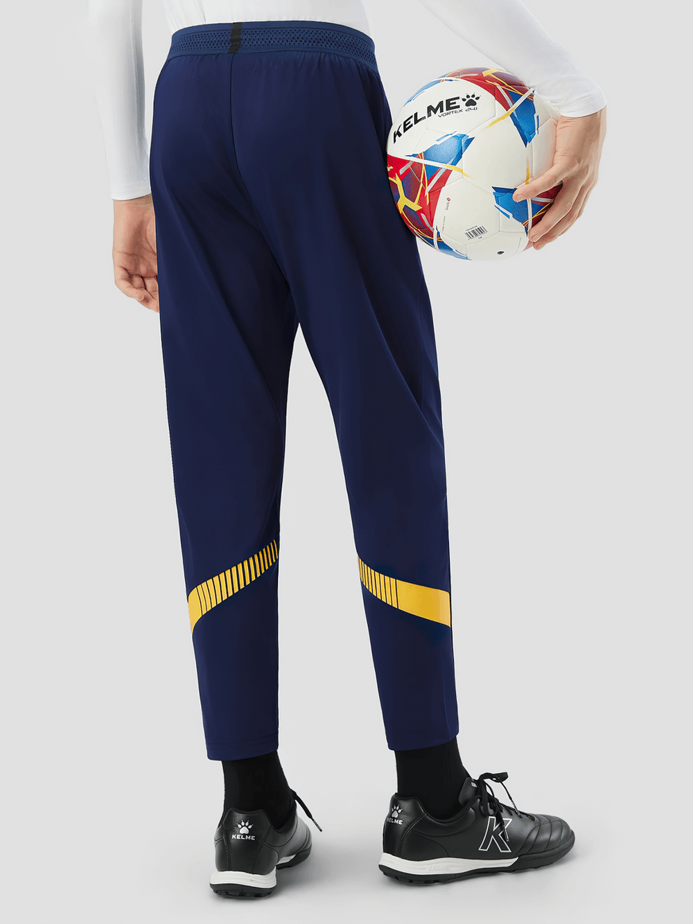 Kids wearing Boys Thermal Training Pants with Elastic Waist - SF3662, holding a soccer ball, showcasing sport style and flexibility.