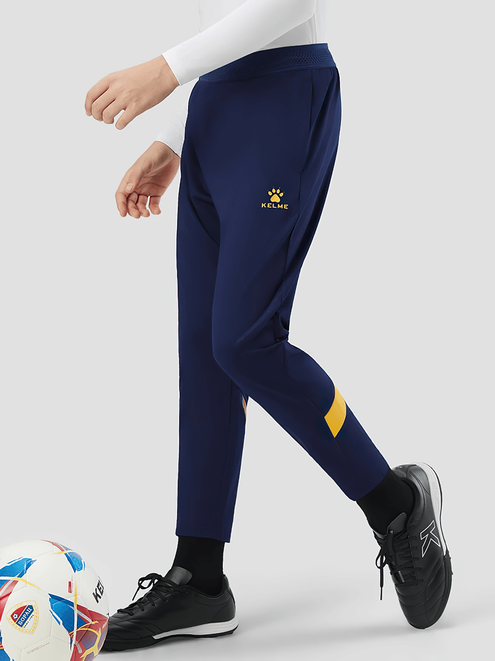 Boy wearing Boys Thermal Training Pants with Elastic Waist - SF3662, fleece-lined blue pants with side pockets, perfect for sports and play.