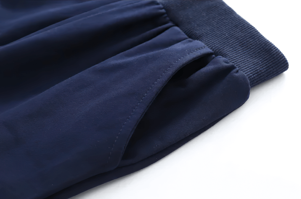 Close-up of Boys Warm Jogger Sweatpants with Elastic Waist - SF3693, showing ribbed cuffs and pocket detail on navy fabric.