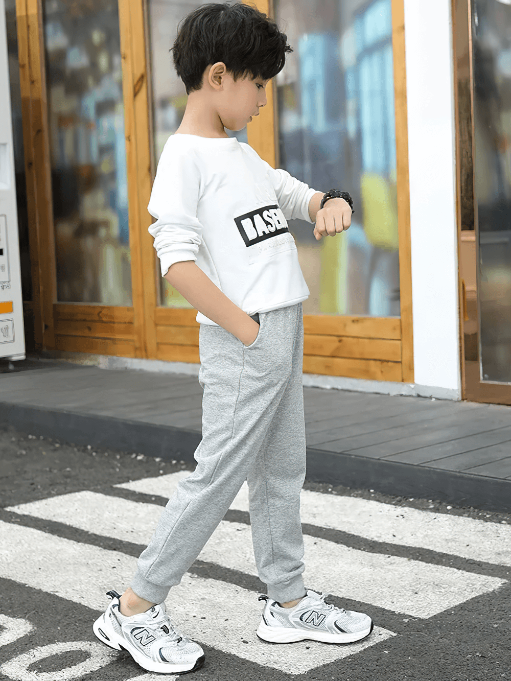 Young boy wearing Boys Warm Jogger Sweatpants with Elastic Waist - SF3693, showcasing outdoor casual style and comfort.