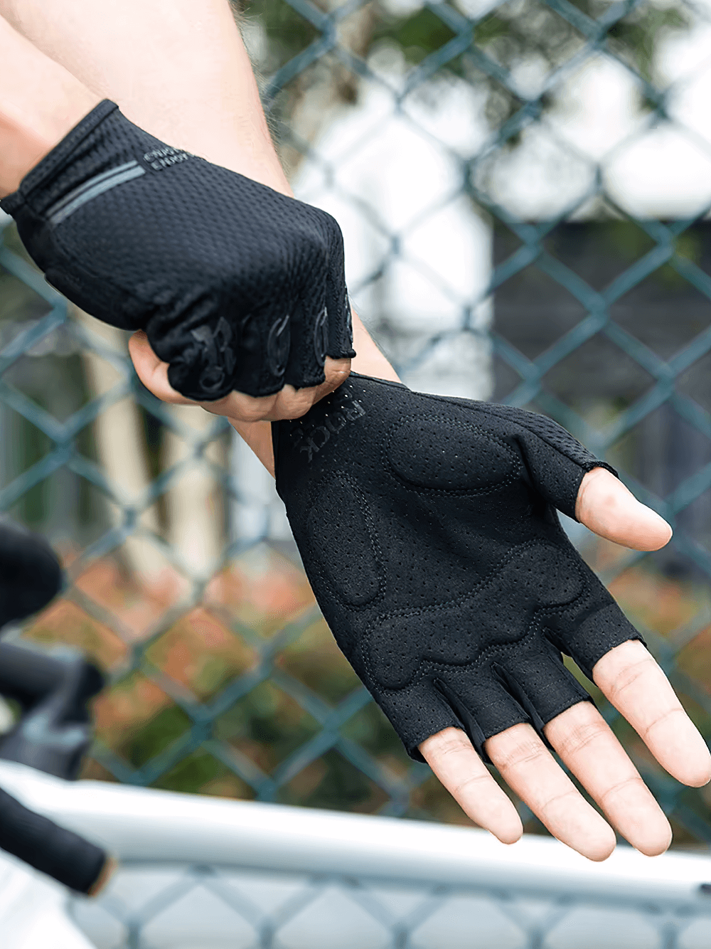 Cyclist wearing breathable anti-shock half-finger gloves with SBR palm pads for superior grip and comfort, perfect for outdoor adventures.