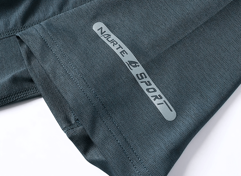 Breathable athletic t-shirt detail with NURTE SPORT logo, showing moisture-wicking fabric texture in black for activewear enthusiasts.