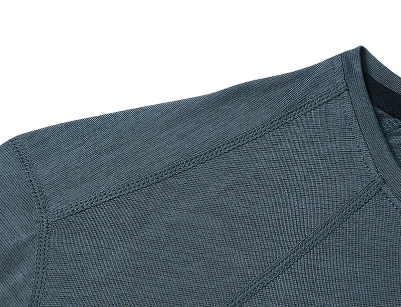 Close-up of breathable athletic t-shirt fabric showcasing moisture-wicking texture for cool, dry comfort in sportswear.