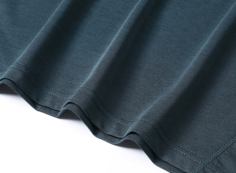 Close-up of black breathable athletic t-shirt fabric, showcasing moisture-wicking and lightweight material for active wear.