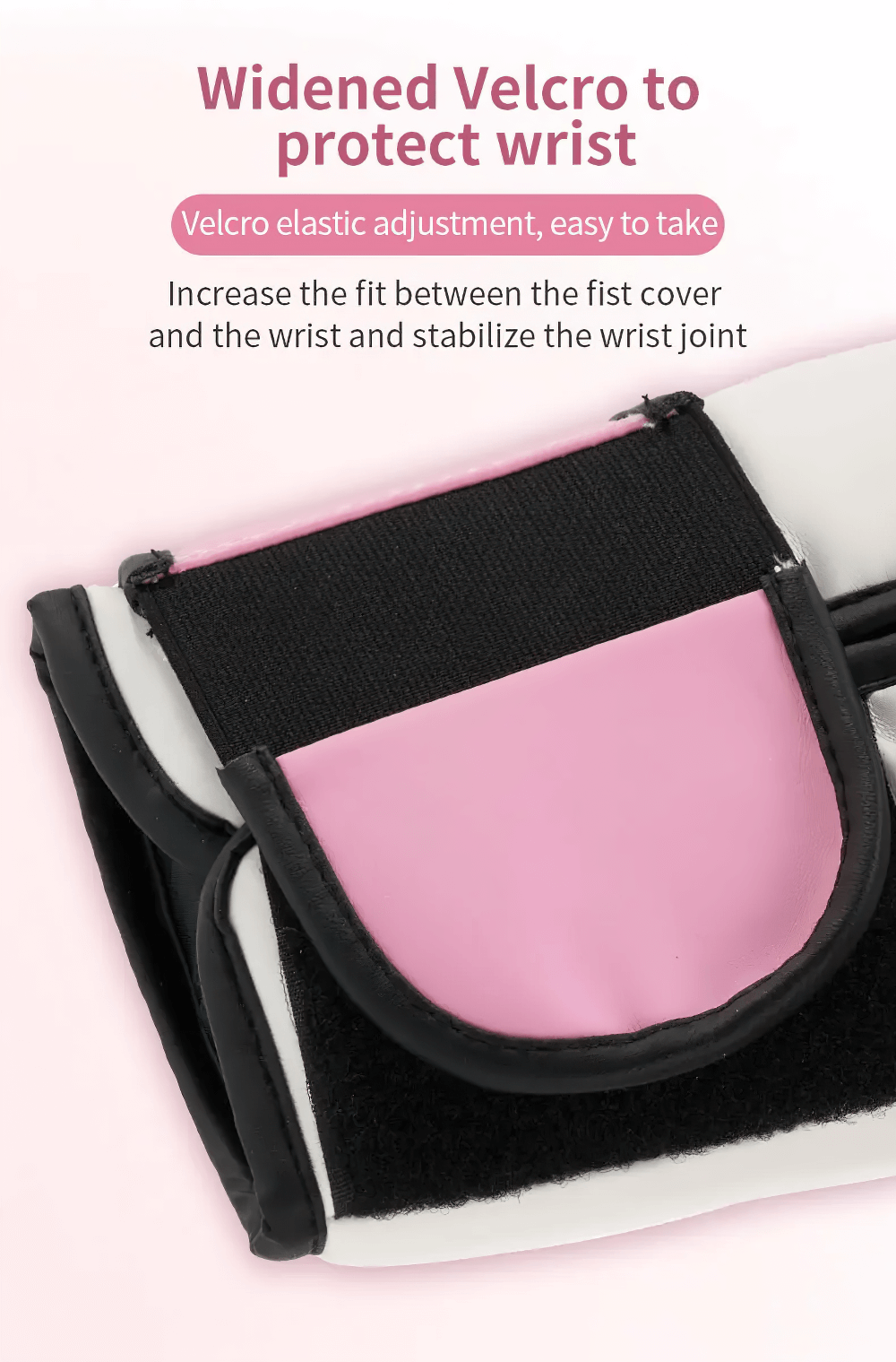 Close-up of boxing glove's widened Velcro feature for wrist protection, showcasing pink and black design.