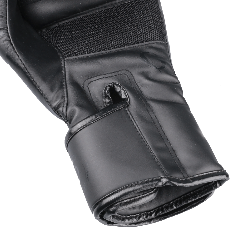 Close-up of SF2686 breathable boxing training gloves in black PU leather for MMA, Muay Thai, and sparring.