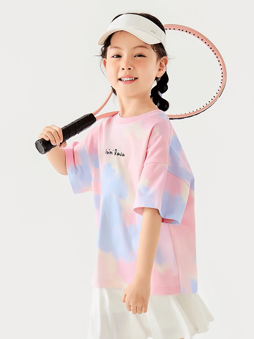 Girl in Breathable Cotton Tie-Dye Tee for Boys and Girls - SF3683, posing with tennis racket, smiling in pastel colors, perfect for summer play.