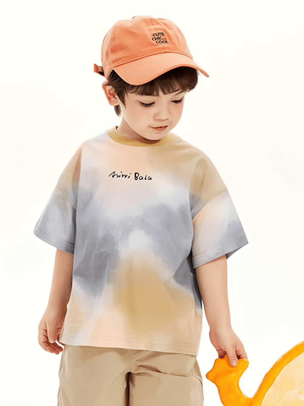 Child wearing a Breathable Cotton Tie-Dye Tee for Boys and Girls - SF3683, enjoying a summer day with vibrant style.
