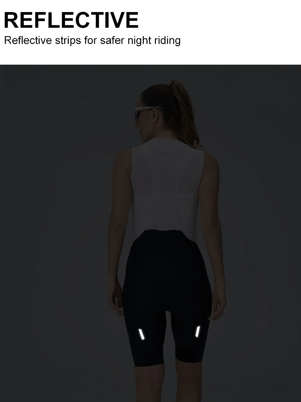 Woman wearing breathable cycling bib shorts with reflective strips for safer night riding.