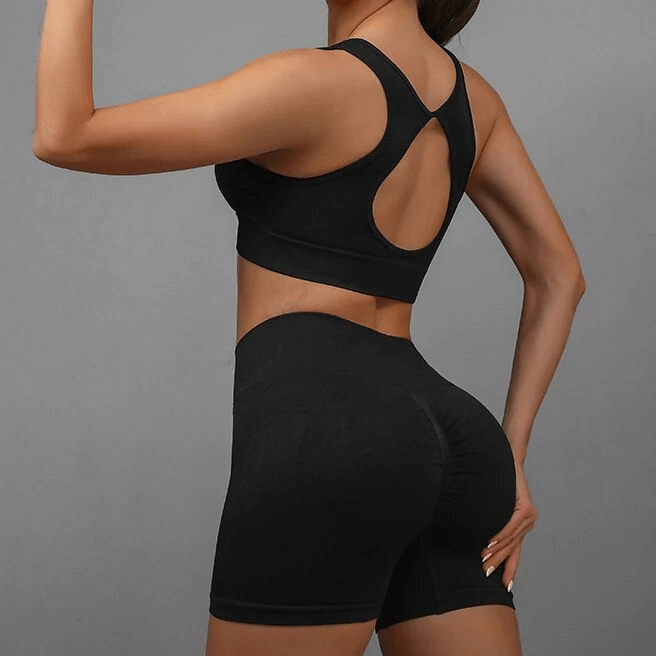 Back view of a breathable elastic women's sports bra and shorts set, perfect for yoga and exercise, offering comfort and high-stretch design.