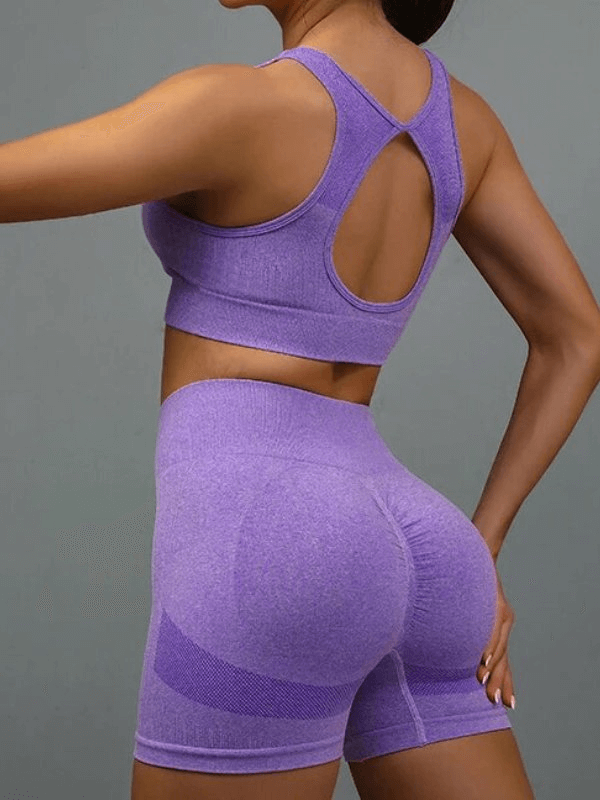 Purple breathable elastic women's sports bra and shorts set, perfect for yoga and exercise, high-stretch Nylon, back view model.