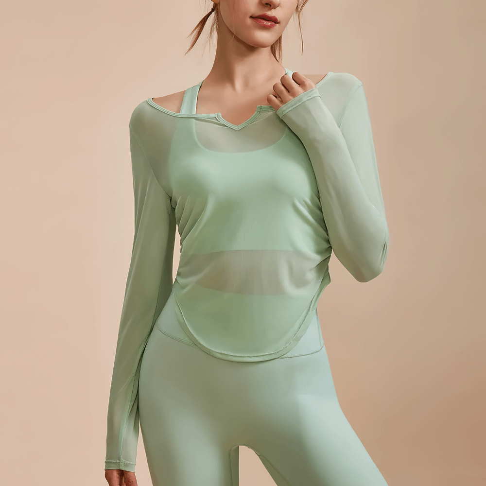 Woman wearing mint breathable long sleeve mesh V-neck yoga top SF2319, showcasing slim fit activewear perfect for running and fitness.
