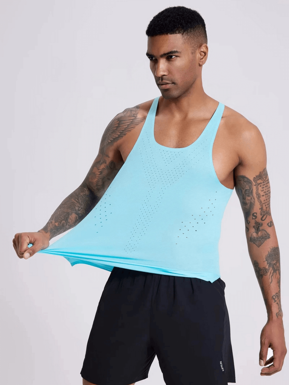 Athlete in vibrant blue breathable men's tank top SF2154, showcasing its elastic fit and perforated design for optimal airflow.