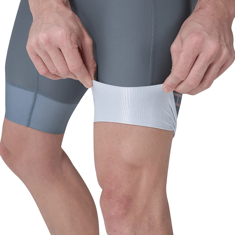 Close-up of breathable men's pro cycling bib shorts showcasing elastic band and ergonomic fit, designed for long-distance rides.