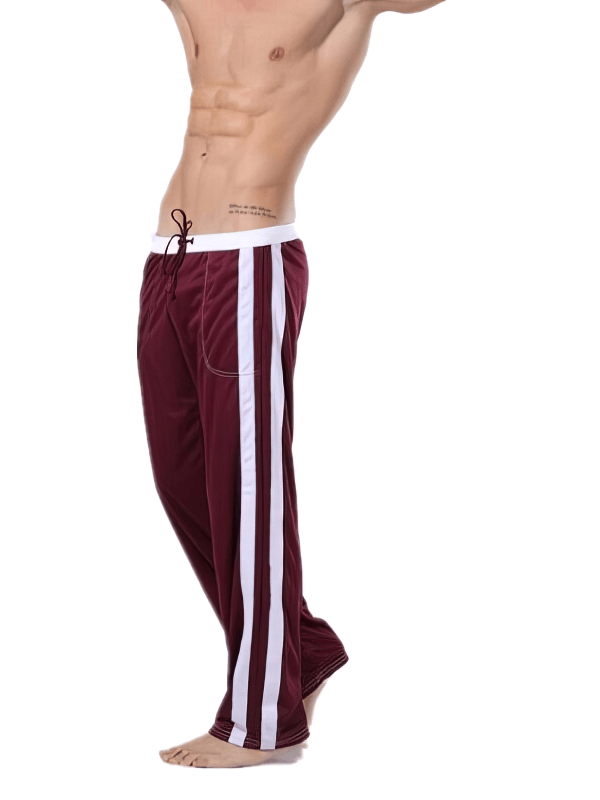 Breathable men's sports training pants with elastic waist and pockets in maroon, ideal for running and gym workouts.