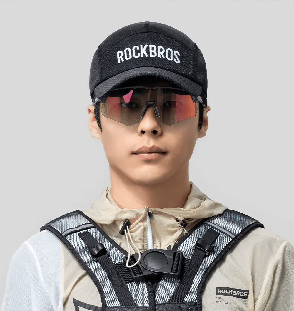 Man wearing a breathable mesh cycling cap and sports gear with sunglasses, perfect for outdoor sports and cycling adventures.