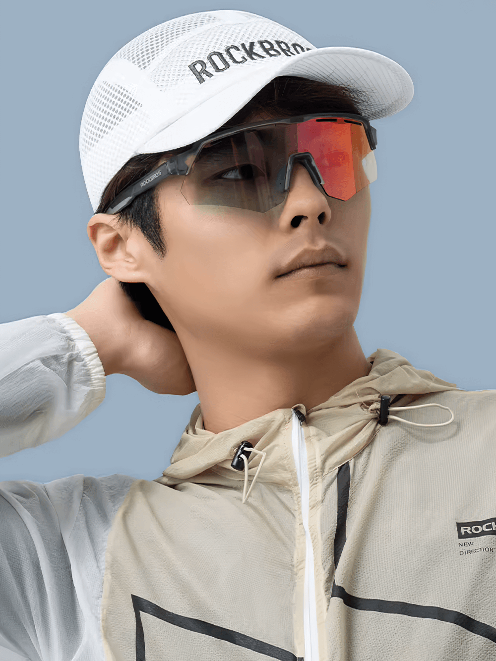 Man wearing breathable mesh cycling cap and reflective sunglasses for outdoor sports.