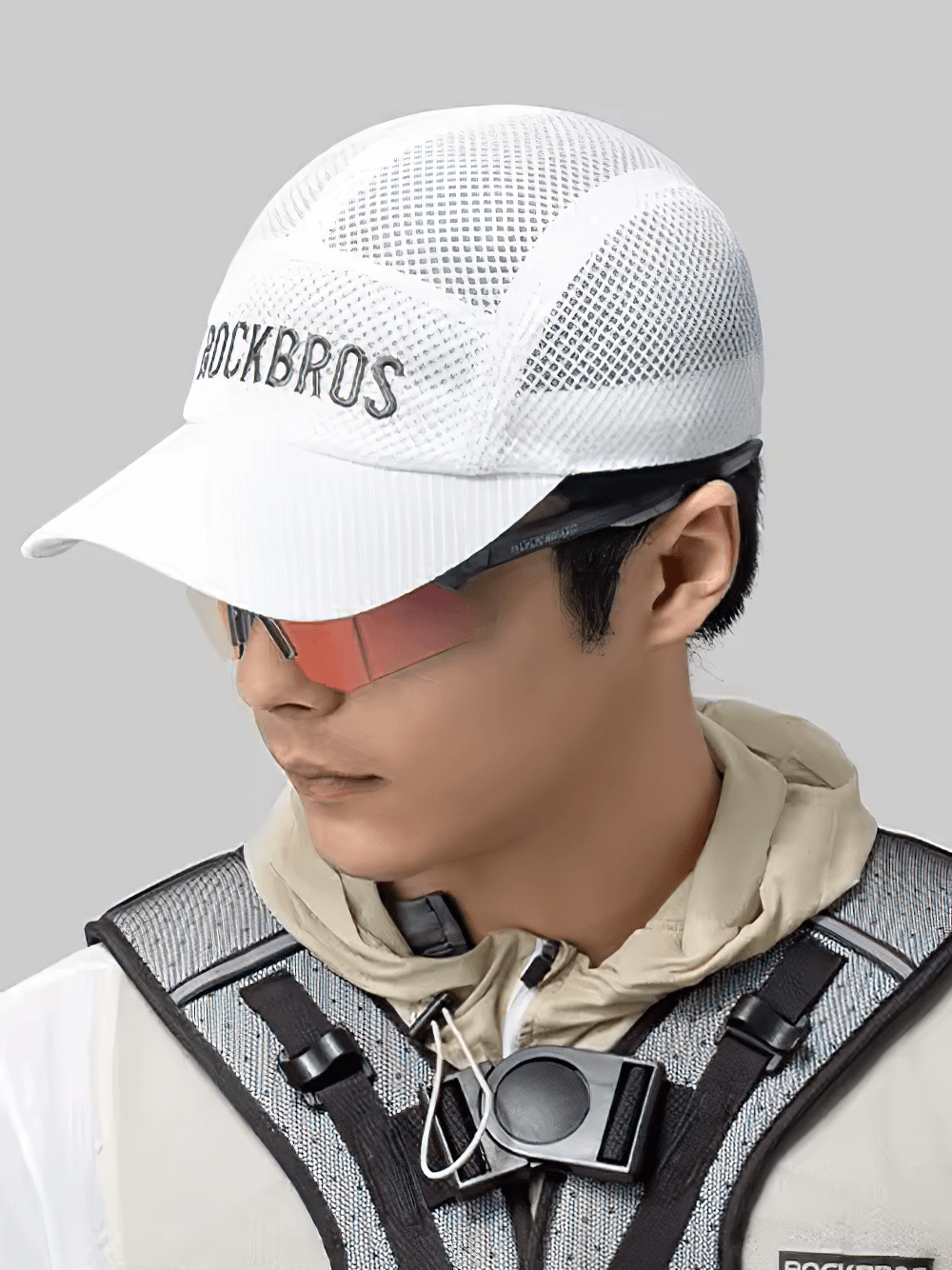 Breathable white mesh cycling cap worn for outdoor sports, featuring sleek design and quick-drying material for enhanced ventilation.