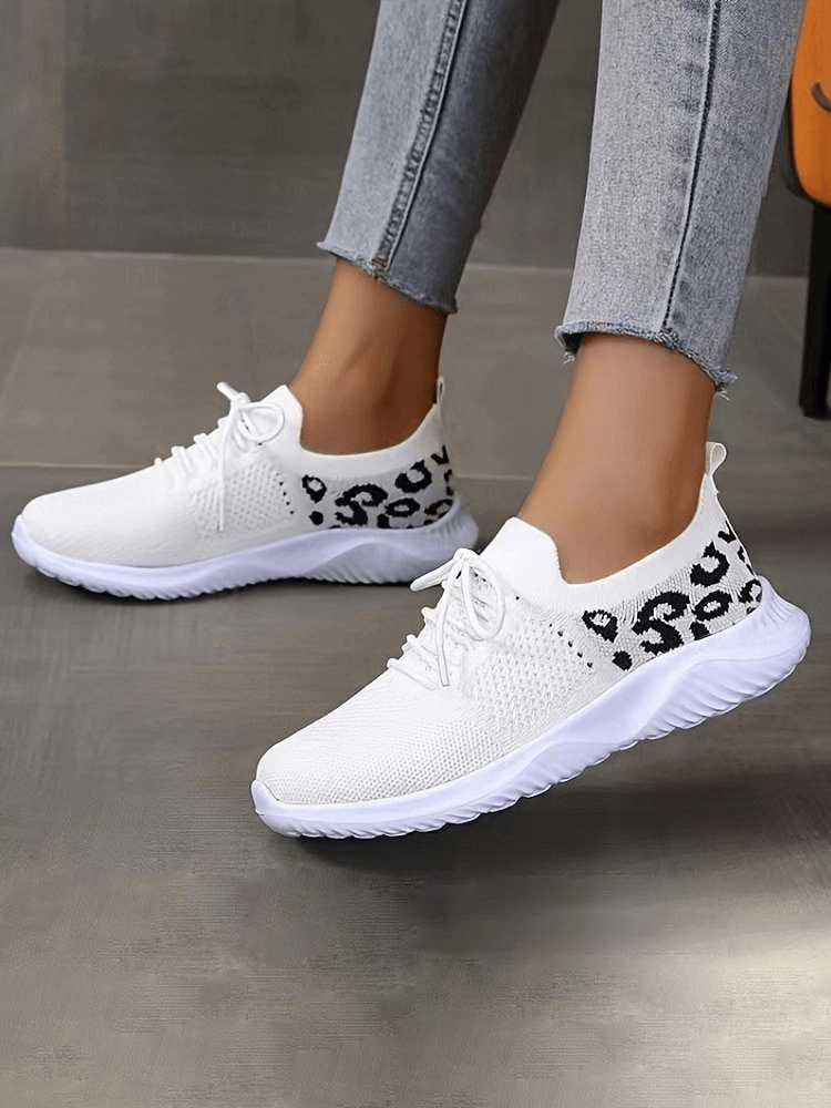 White breathable mesh sneakers with leopard print, lace-up sports shoes for women, soft sole for comfort and style.