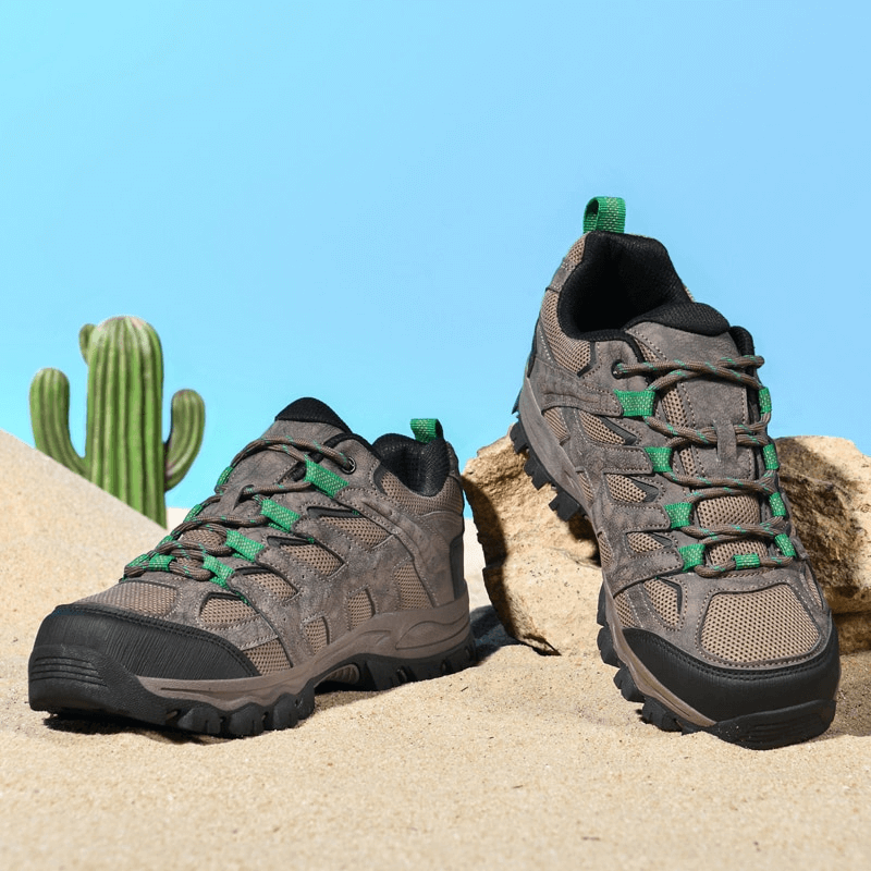 Breathable non-slip hiking shoes for men with laces, SF1411, on desert sand with a cactus background.