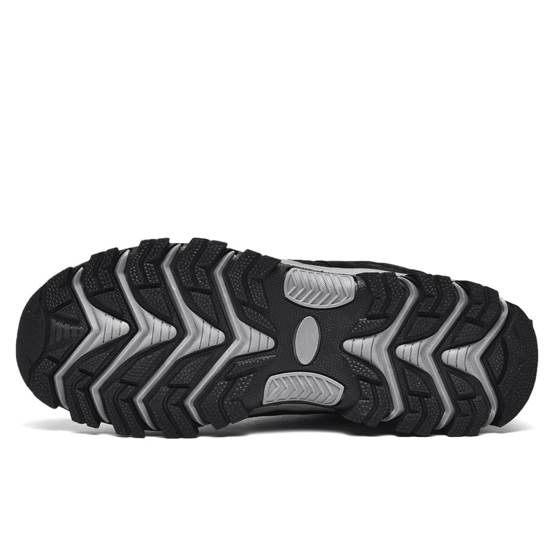 Close-up of hiking shoe sole with non-slip EVA outsole pattern for rugged terrain traction.