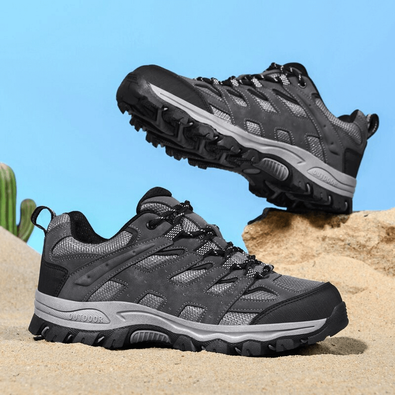Breathable non-slip hiking shoes for men with laces, SF1411, shown in rugged environment. Features durable polyester and anti-slip EVA outsole.