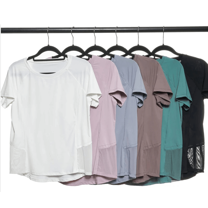 Colorful breathable nylon gym wear on hangers, ideal for yoga and running. Short-sleeved and solid pattern for ultimate performance.