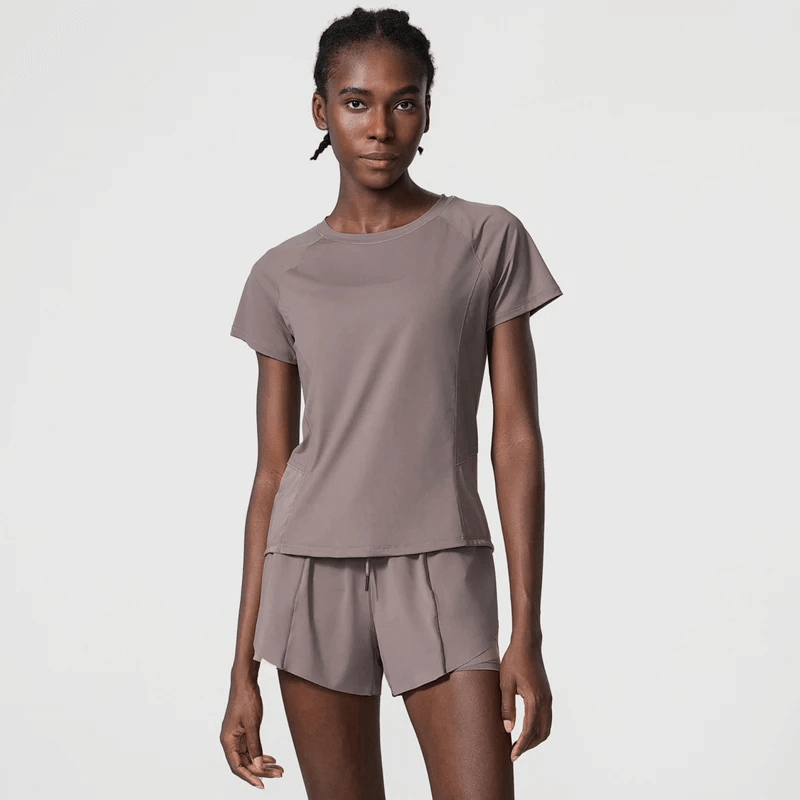 Women's breathable nylon gym wear for yoga and running, quick-dry and anti-wrinkle, featuring short sleeves and a solid pattern.