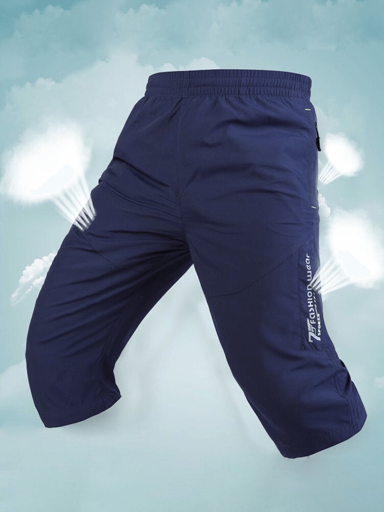 Breathable Quick Dry Men's Long Shorts with Zipper Pockets SF1353, knee-length and elastic waistband, shown in navy blue.