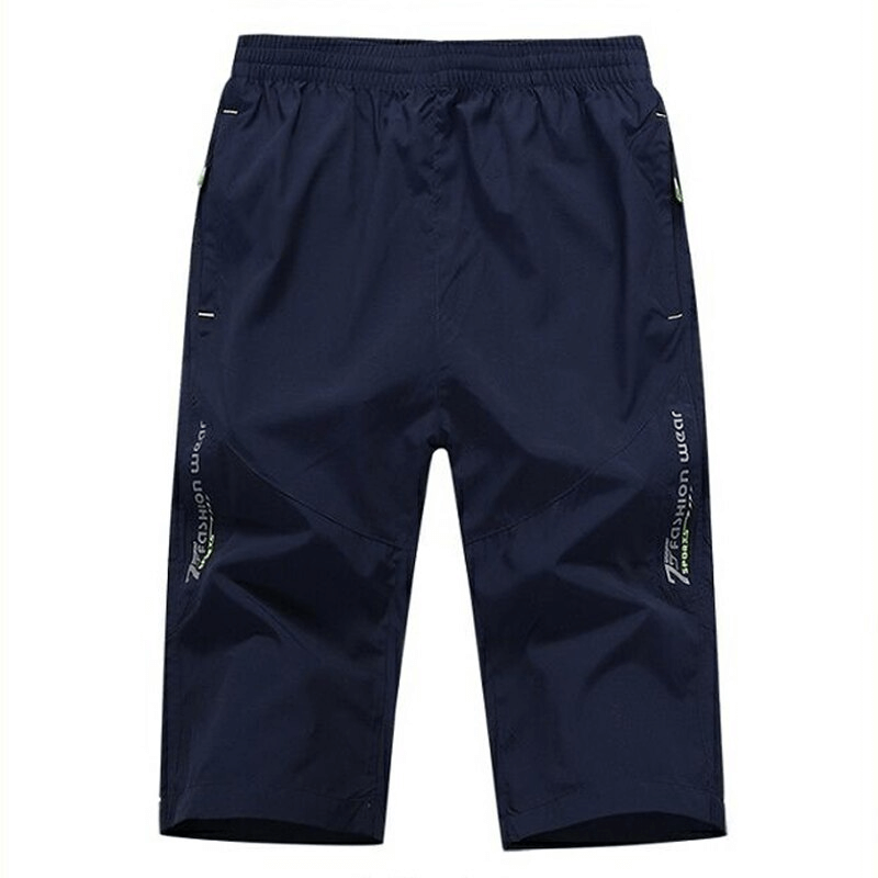 Breathable Quick Dry Men's Long Shorts with Zipper Pockets, navy color, featuring a micro-bullet elastic waistband and knee-length design.