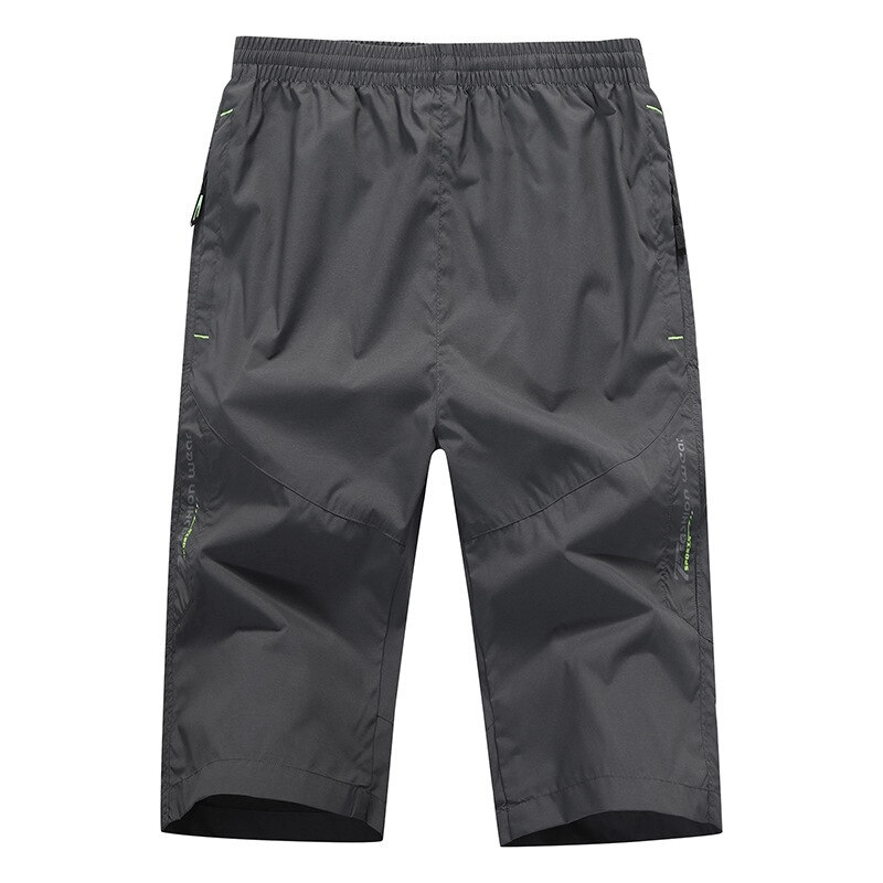 Breathable quick dry men's long shorts with zipper pockets in dark grey, featuring a straight fit and elastic waistband.