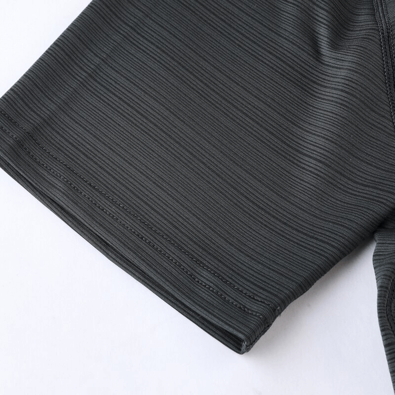 Close-up of breathable quick-drying sports t-shirt sleeve in solid grey color, ideal for training and fitness activities.