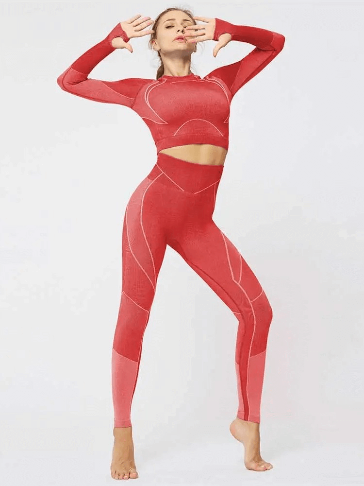 Sporty woman modeling breathable red leggings and long sleeve top set for yoga and sports, featuring a geometric pattern.