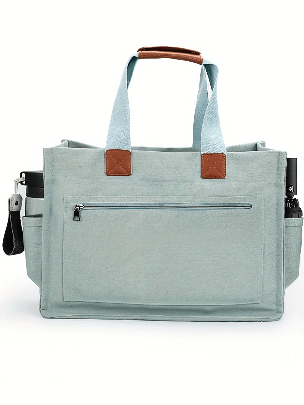 Light blue canvas tote bag with adjustable strap and front zippered pocket, ideal for daily use and carrying essentials.