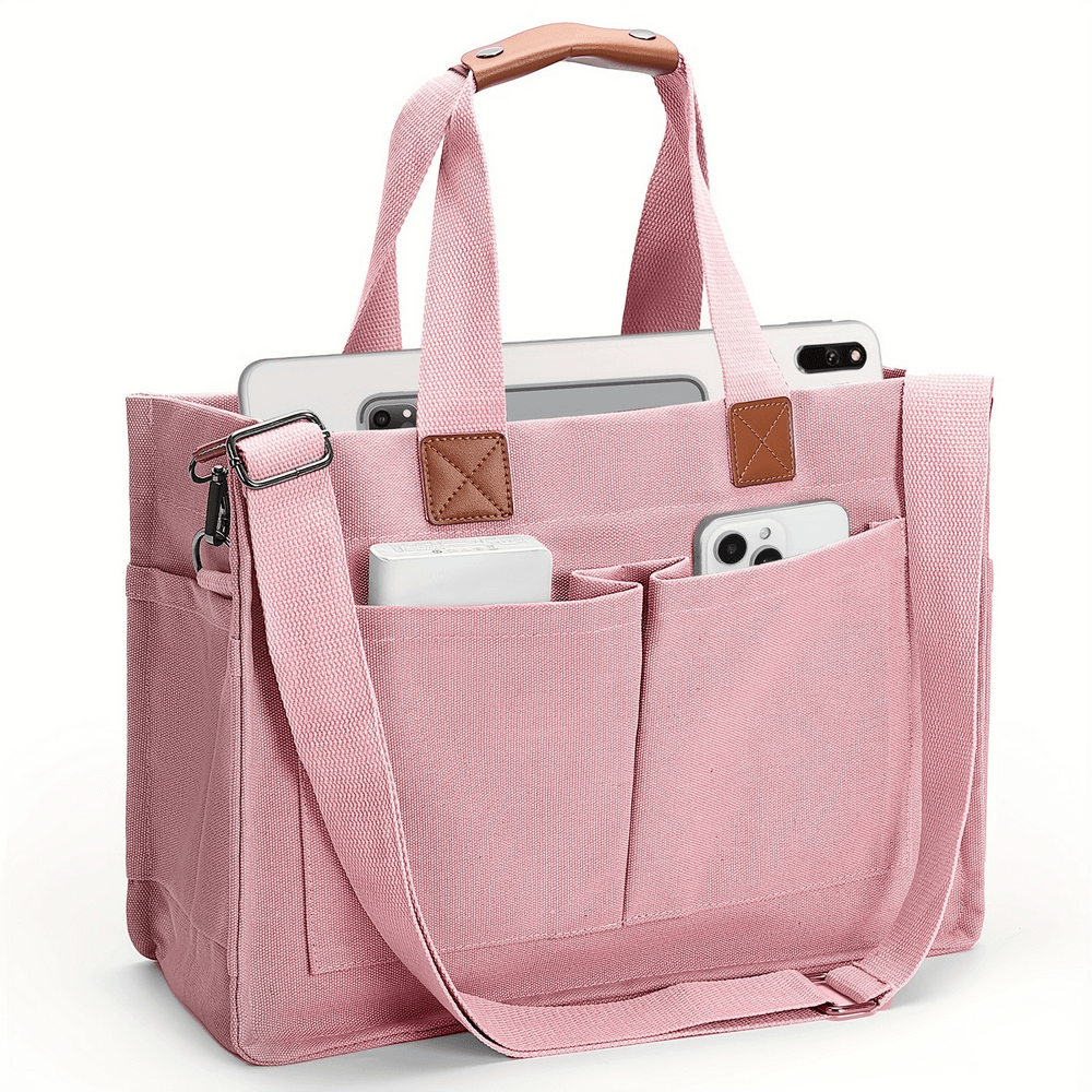 Pink canvas tote bag with adjustable strap, filled with gadgets, showing spacious compartments and durable design.