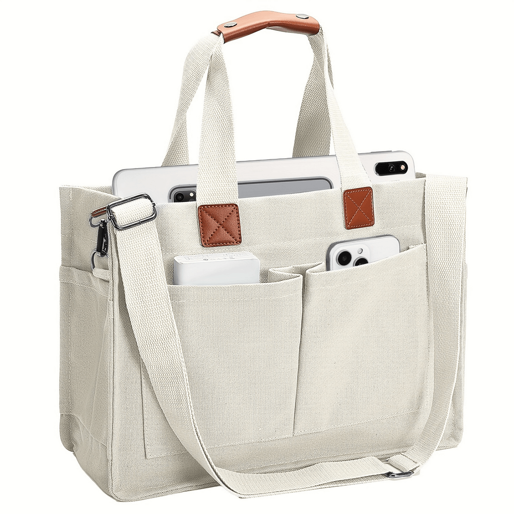 Large-capacity canvas tote bag with adjustable strap, secure buckle, and multiple pockets for gadgets, ideal for daily use.