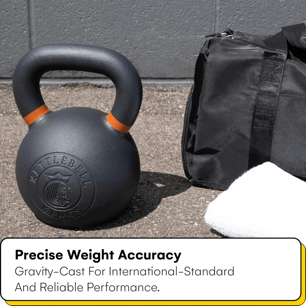 Cast iron kettlebell beside a gym bag and towel, showcasing precise weight accuracy and gravity-cast design for reliable workouts.