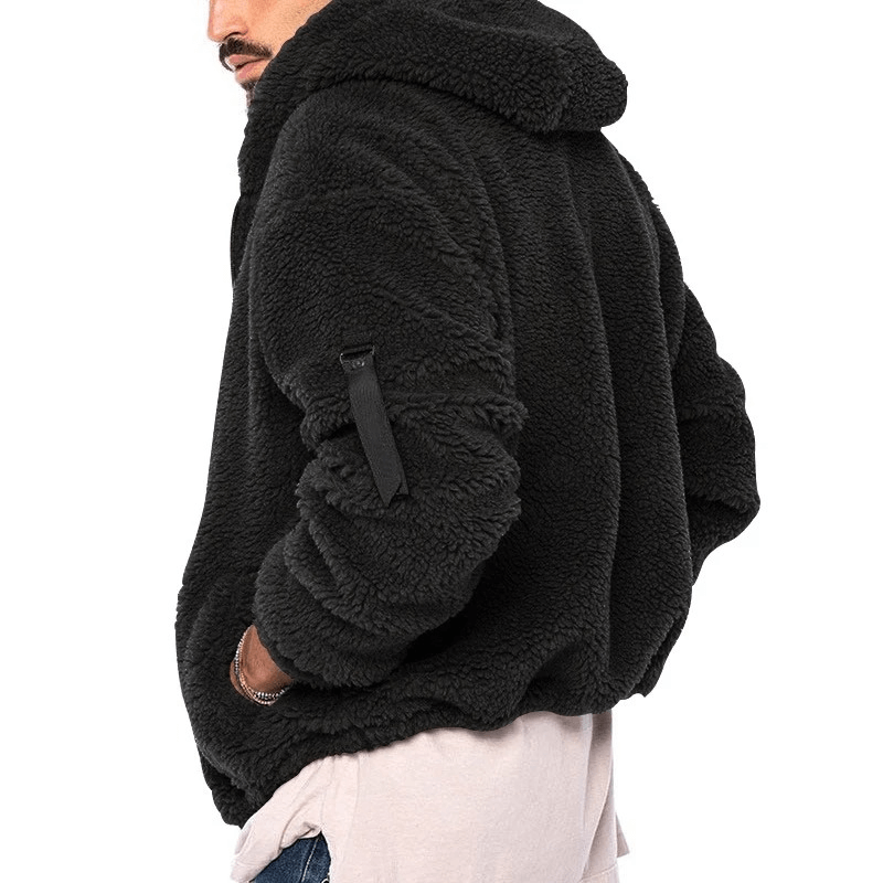 Man wearing black fleece zip-up hooded jacket SF1897 for outdoor use, featuring cozy cotton/polyester blend with zipper closure.